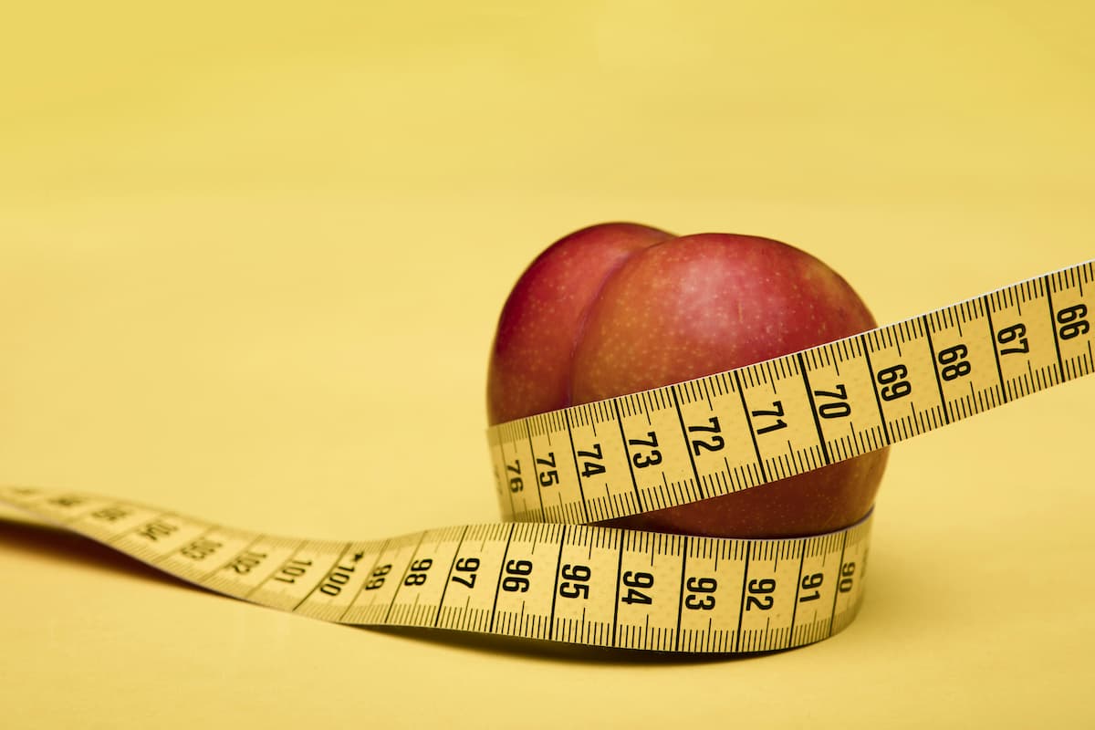 Apple with measuring tape